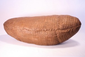 POD(copper), 10 x 31 x 11", wool, beeswax, thread, pigment, recycled fill; handfelted, stitched, encaustic. 2013