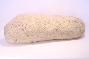 POD(cream), 11 x 38 x 13", wool, beeswax, thread, pigment, recycled fill; handfelted, stitched, encaustic. 2013